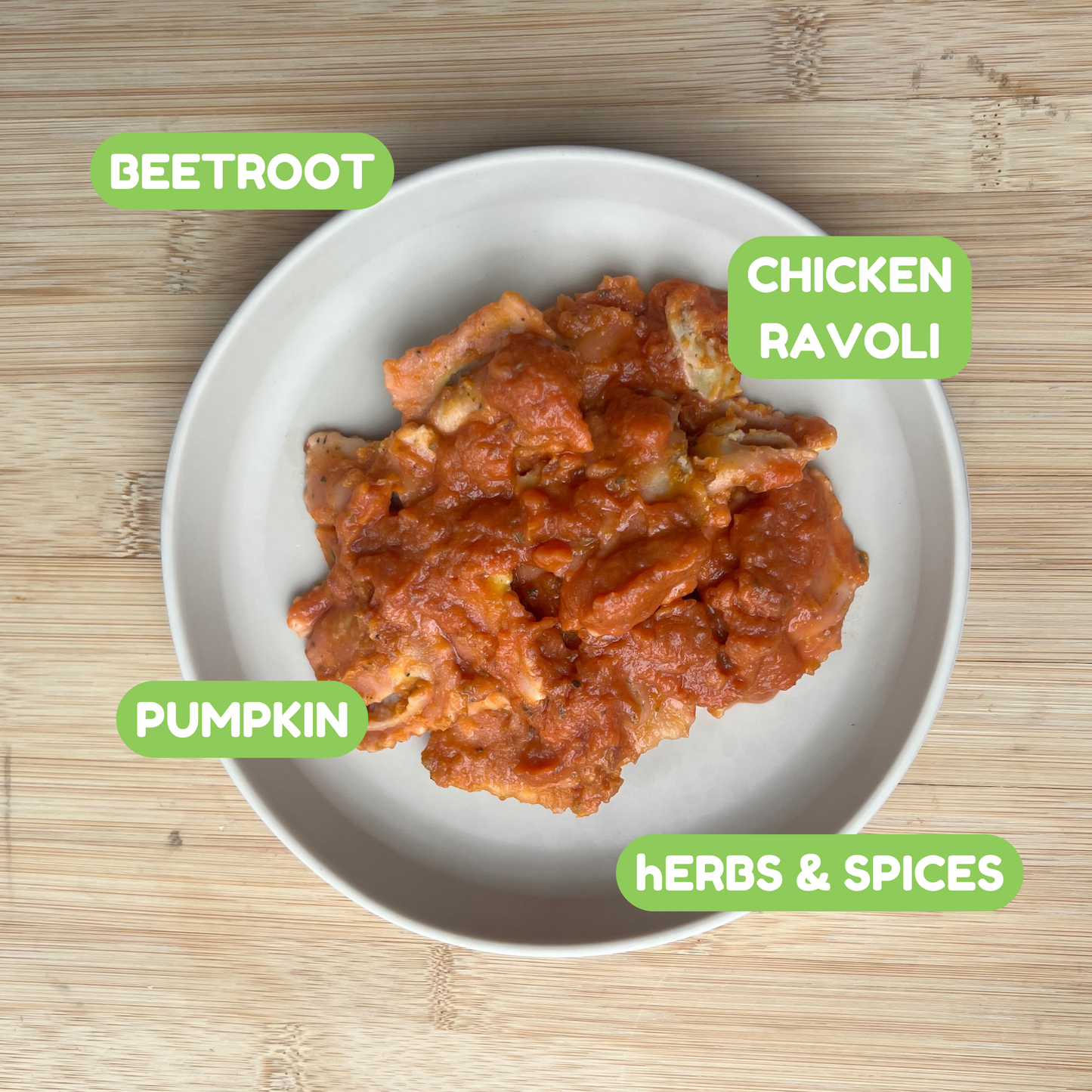 
                  
                    A plate of chicken ravioli in a red sauce, labeled with green text bubbles highlighting ingredients: 'Beetroot,' 'Pumpkin,' 'Chicken Ravioli,' and 'Herbs & Spices
                  
                