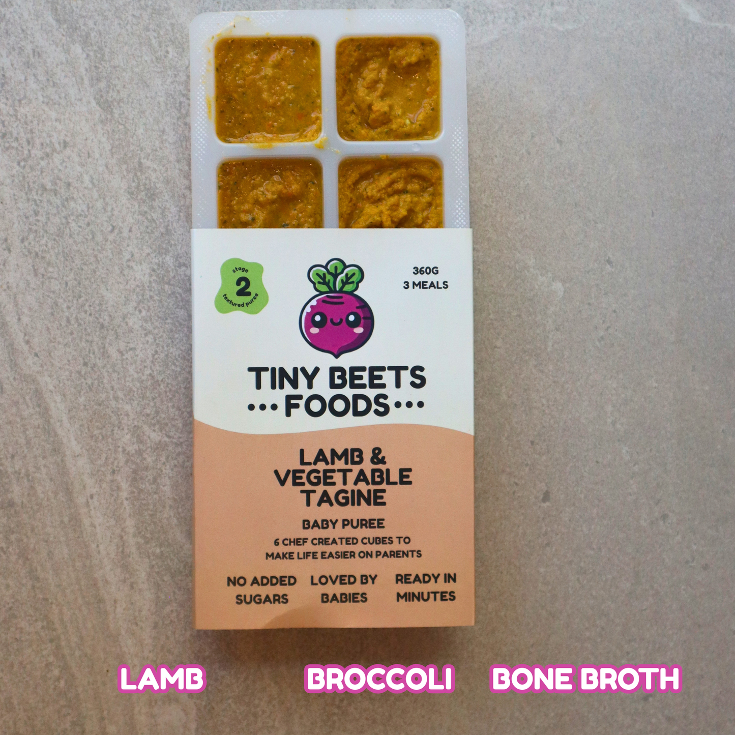 Box of Tiny Beets Foods Lamb & Vegetable Tagine baby puree on a gray background